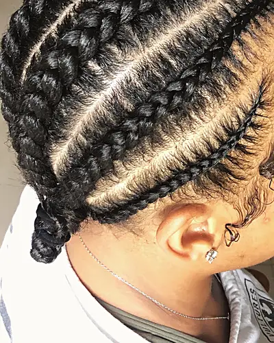 Stitch braids worn by a client