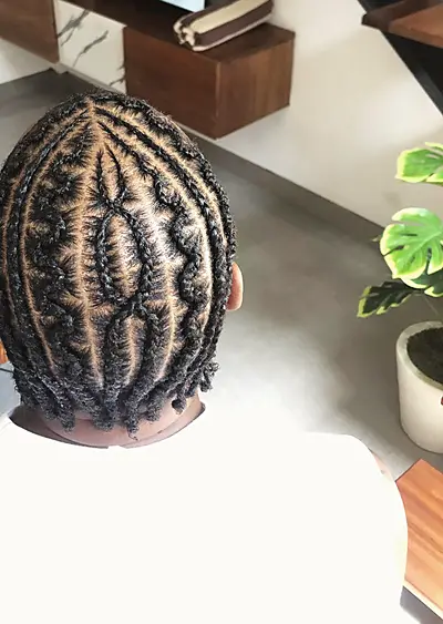 Cornrows seen from above, curved parting