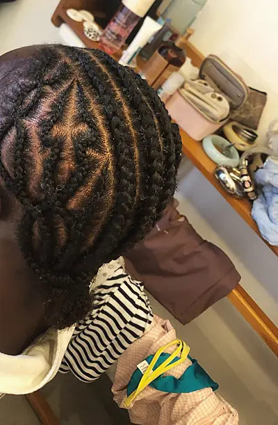 Cornrows with a diamond parting